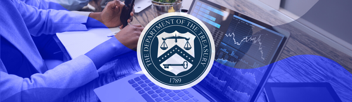 A woman working at a desk with a laptop displaying a dashboard with graphs. The Department of Treasury seal is overlaid on top